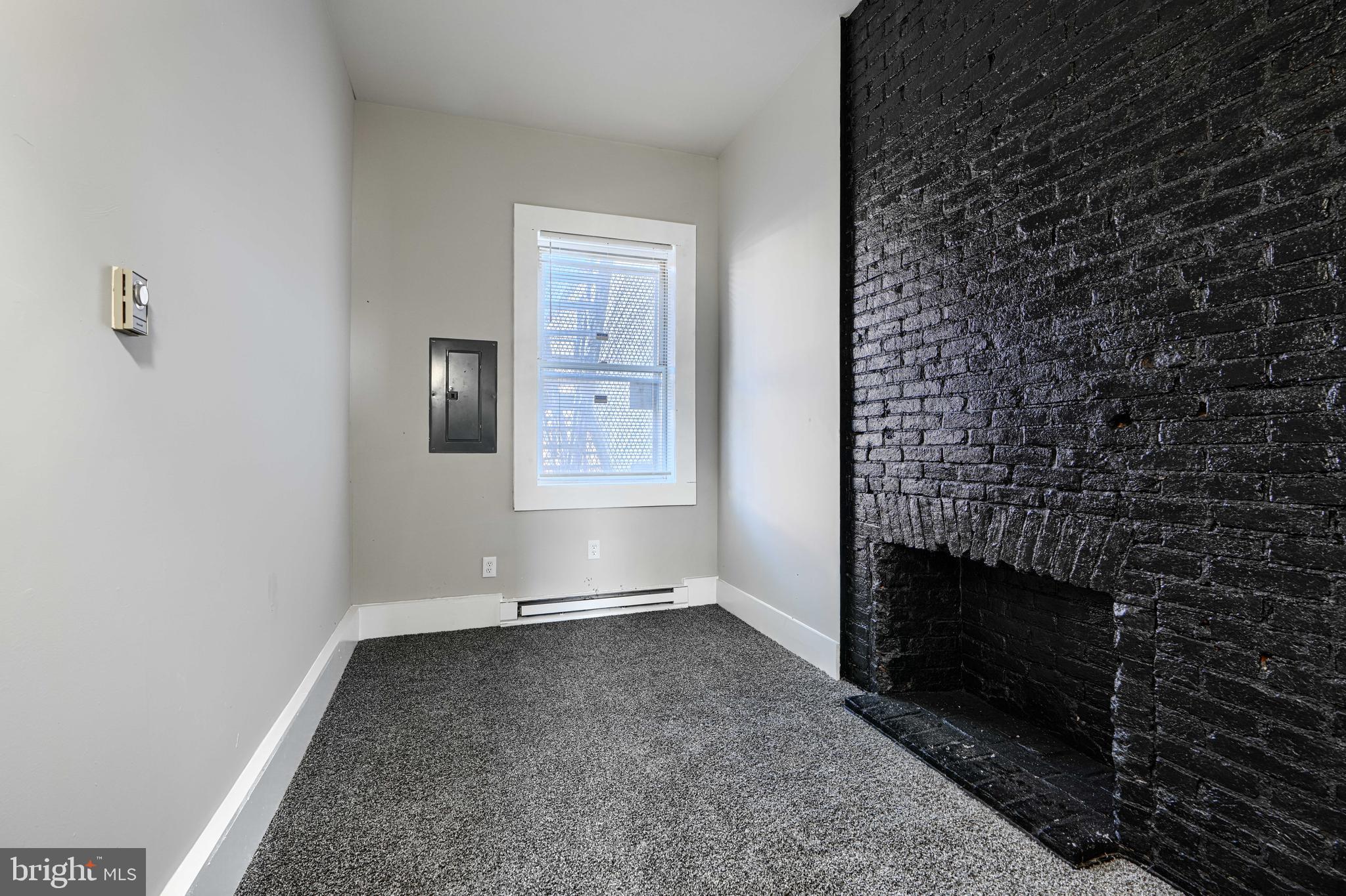 617 North Paca Street Baltimore, MD 21201 - Photo 3 of 20 a view of empty room with windows