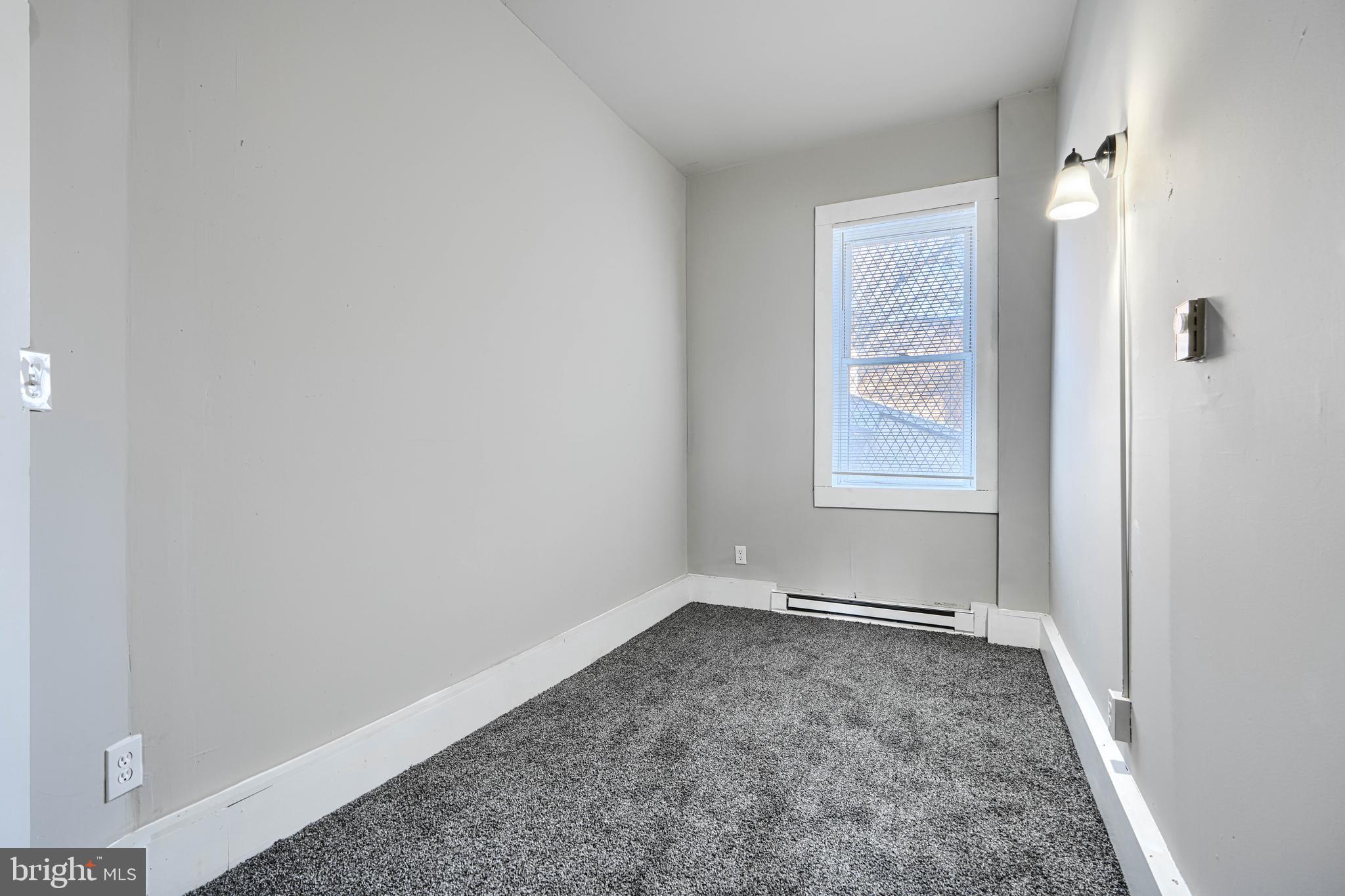 617 North Paca Street Baltimore, MD 21201 - Photo 5 of 20 an empty room with windows