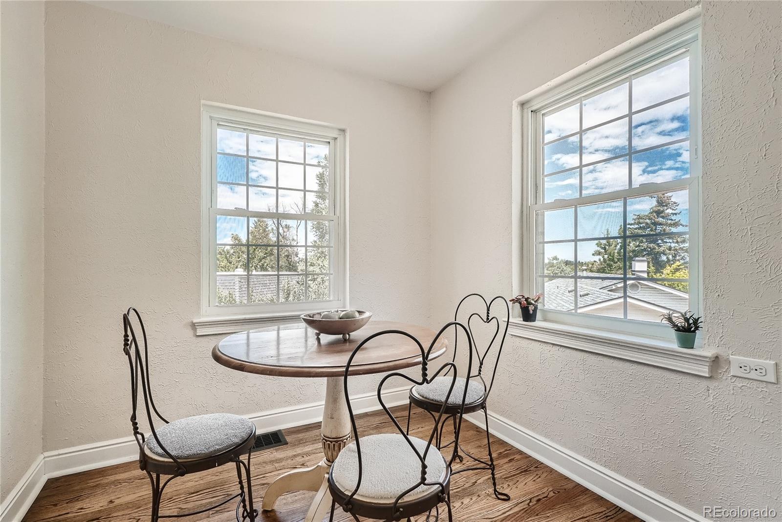 1209 West Ridge Road Littleton, CO 80120 - Photo 12 of 33 a view of a dining room with furniture window and outside view