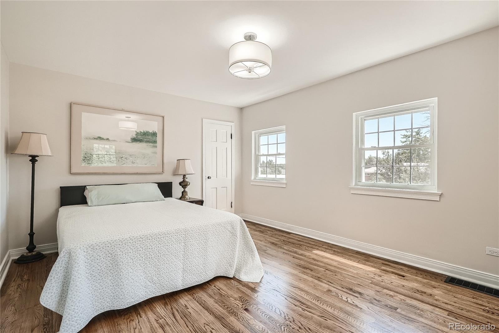 1209 West Ridge Road Littleton, CO 80120 - Photo 17 of 33 a bedroom with a bed and a window