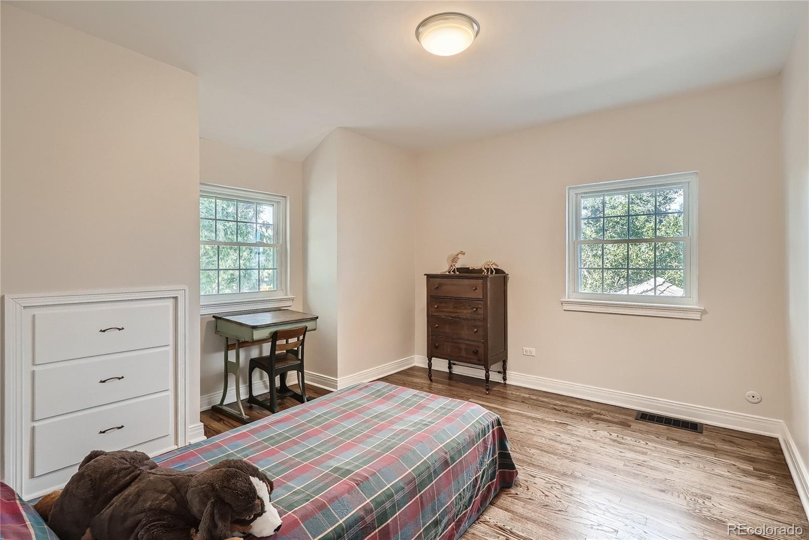 1209 West Ridge Road Littleton, CO 80120 - Photo 20 of 33 a bedroom with a bed and a window