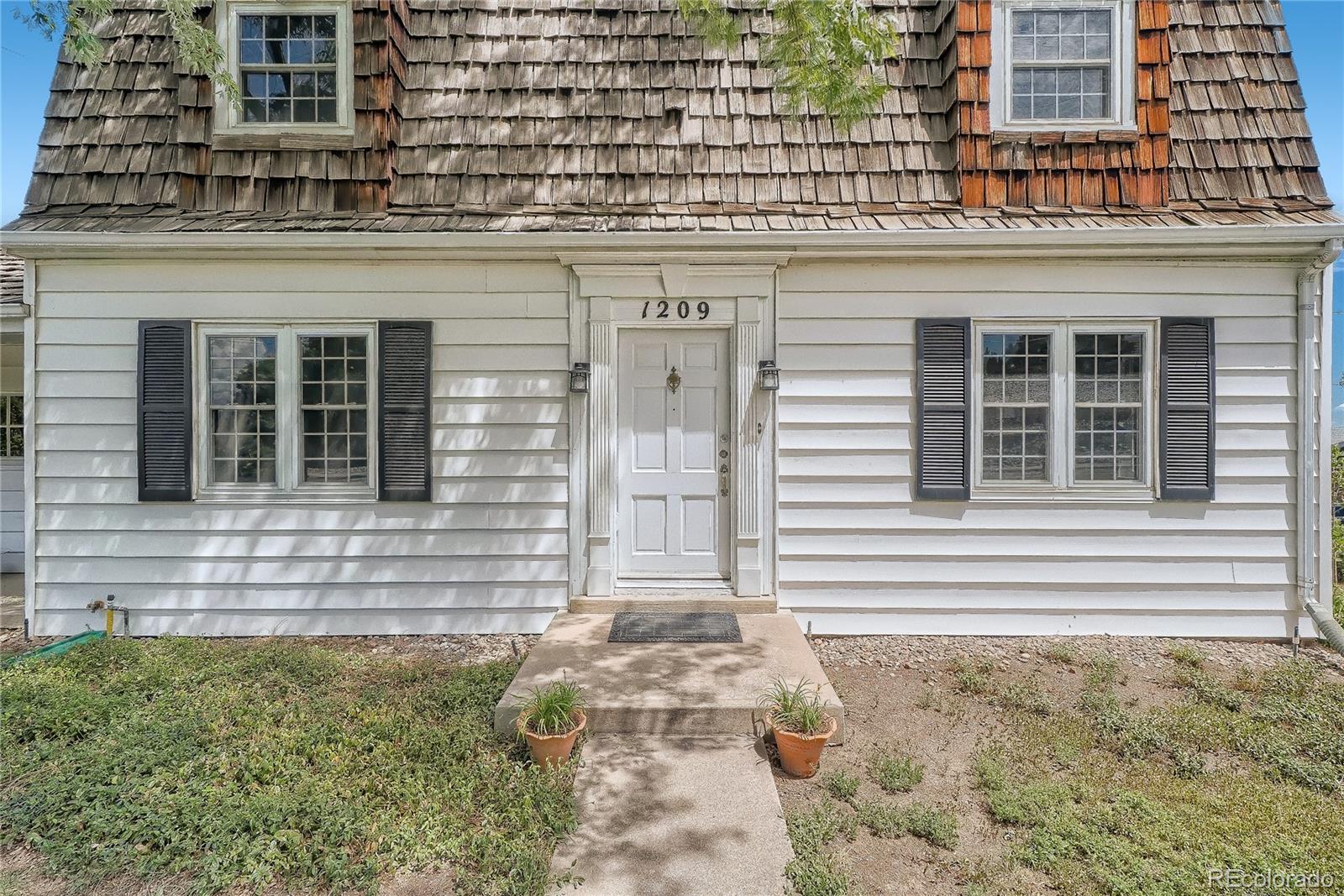 1209 West Ridge Road Littleton, CO 80120 - Photo 3 of 33 a front view of a house