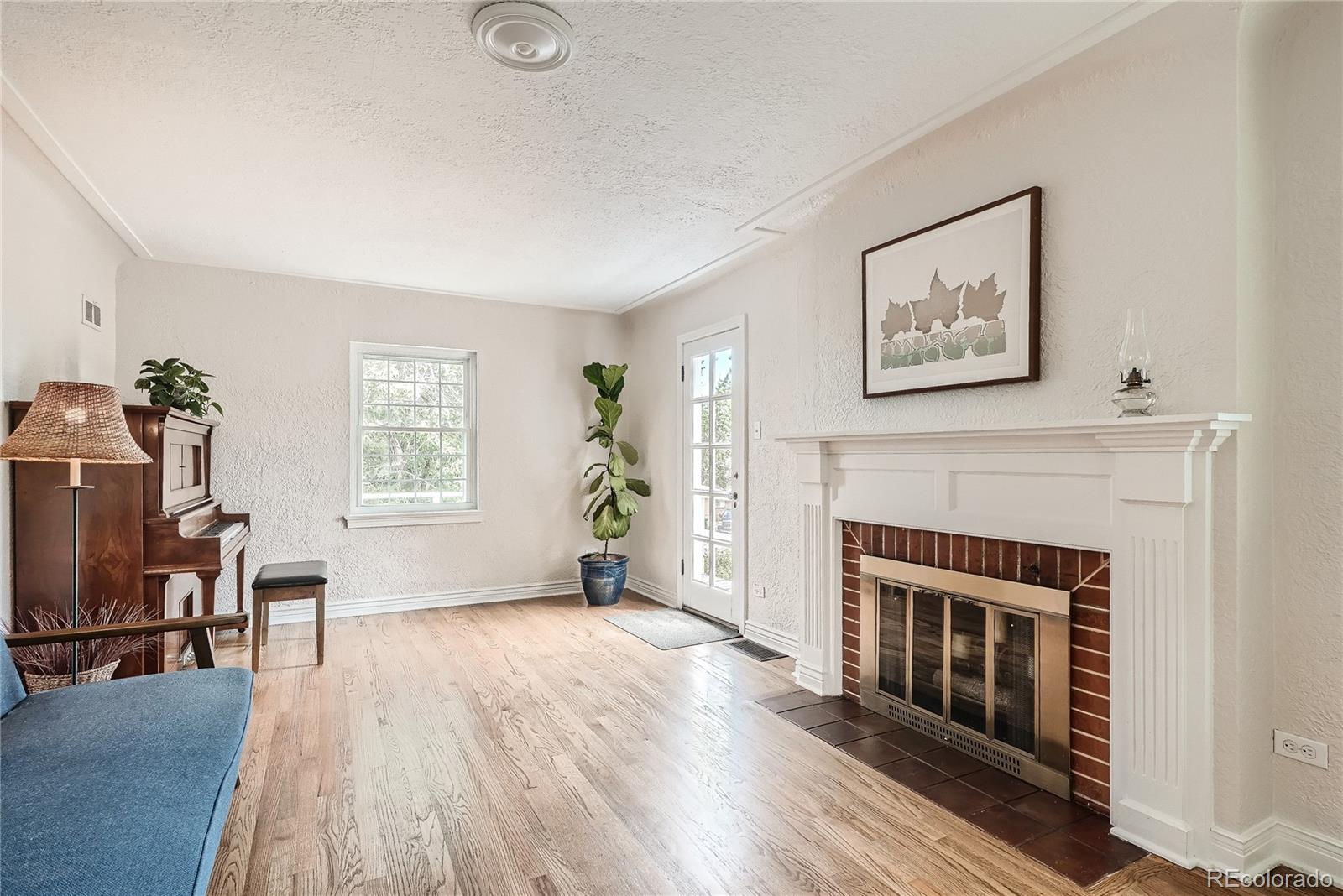 1209 West Ridge Road Littleton, CO 80120 - Photo 5 of 33 a living room with furniture and a fireplace