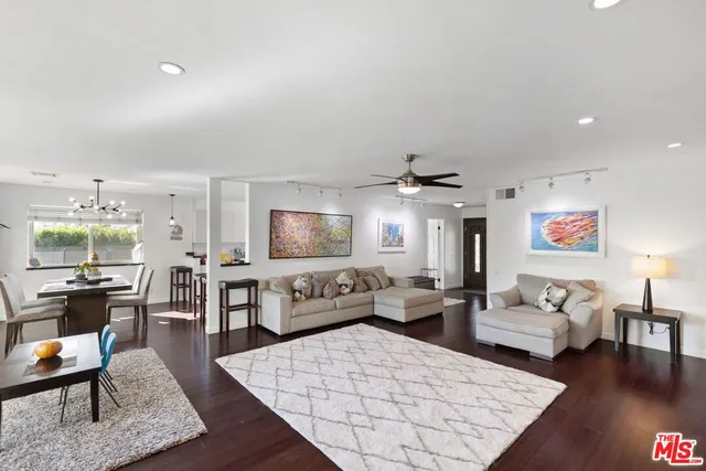 a living room with furniture rug and window