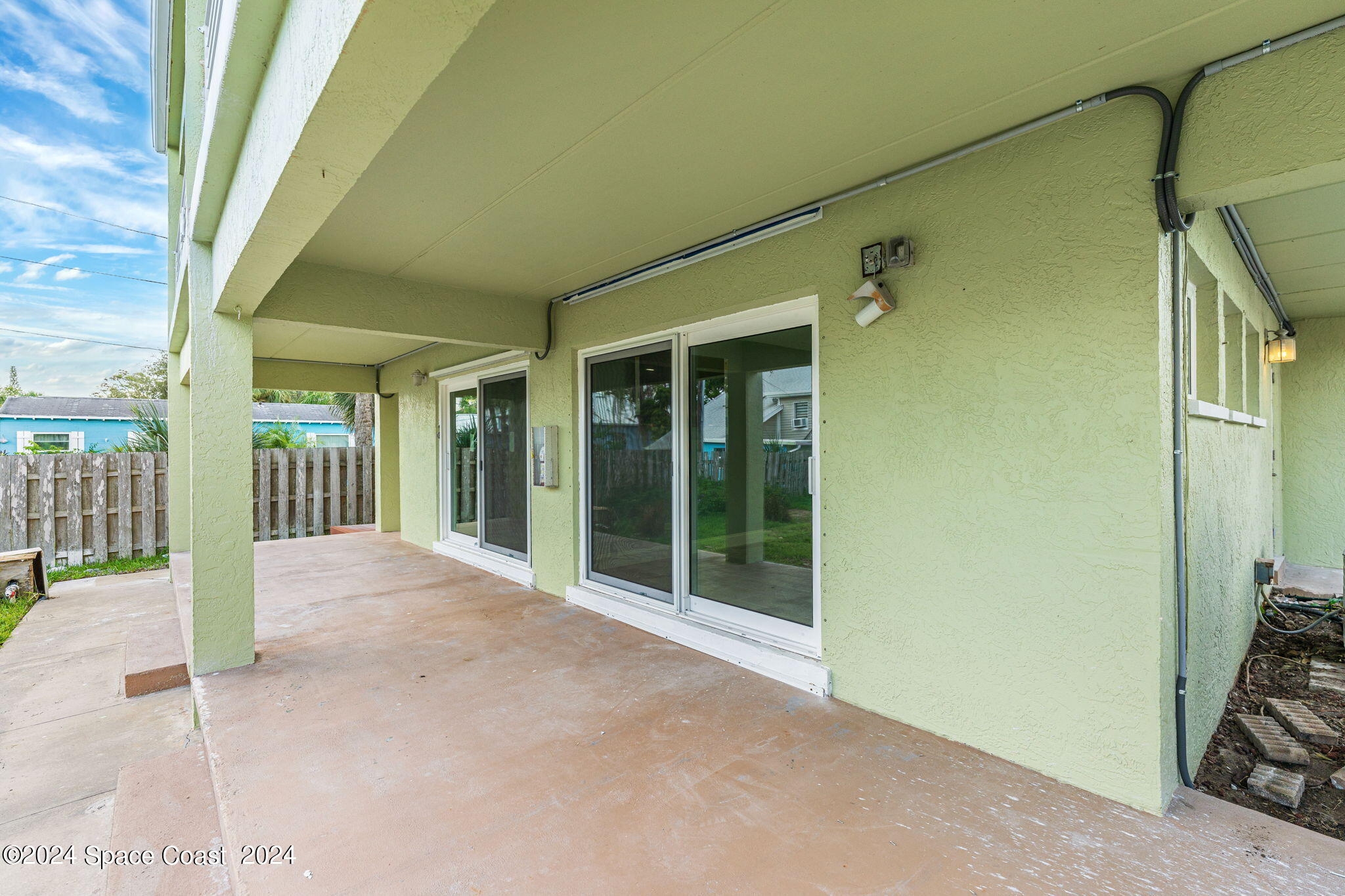2189 Pineapple Avenue, Unit C Melbourne, FL 32935 - Photo 27 of 67 a view of a room with wooden floor and windows