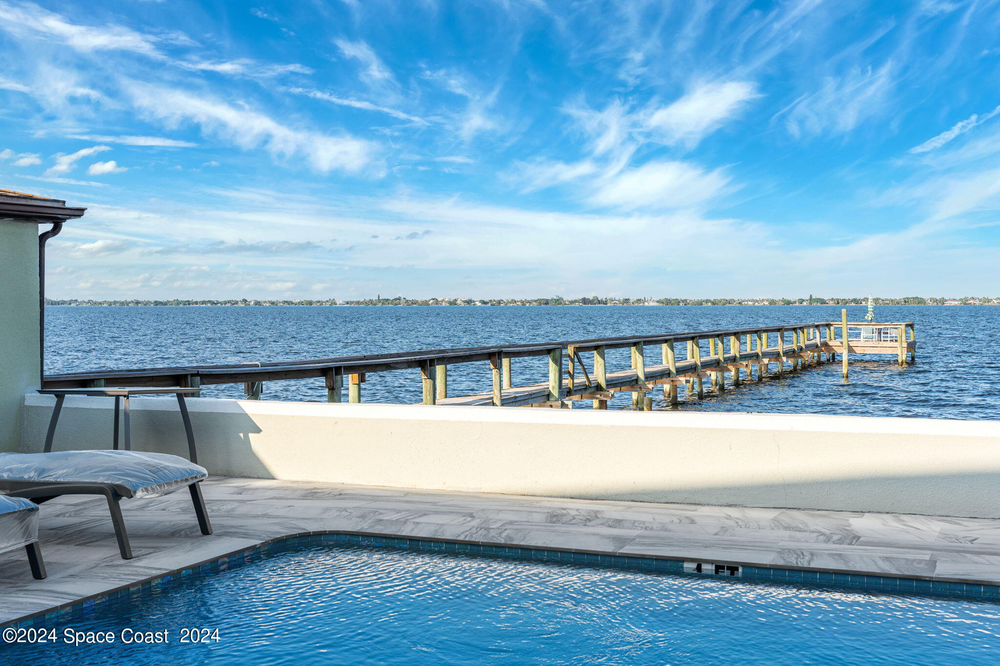 2189 Pineapple Avenue, Unit C Melbourne, FL 32935 - Photo 51 of 67 a view of a swimming pool with an outdoor seating