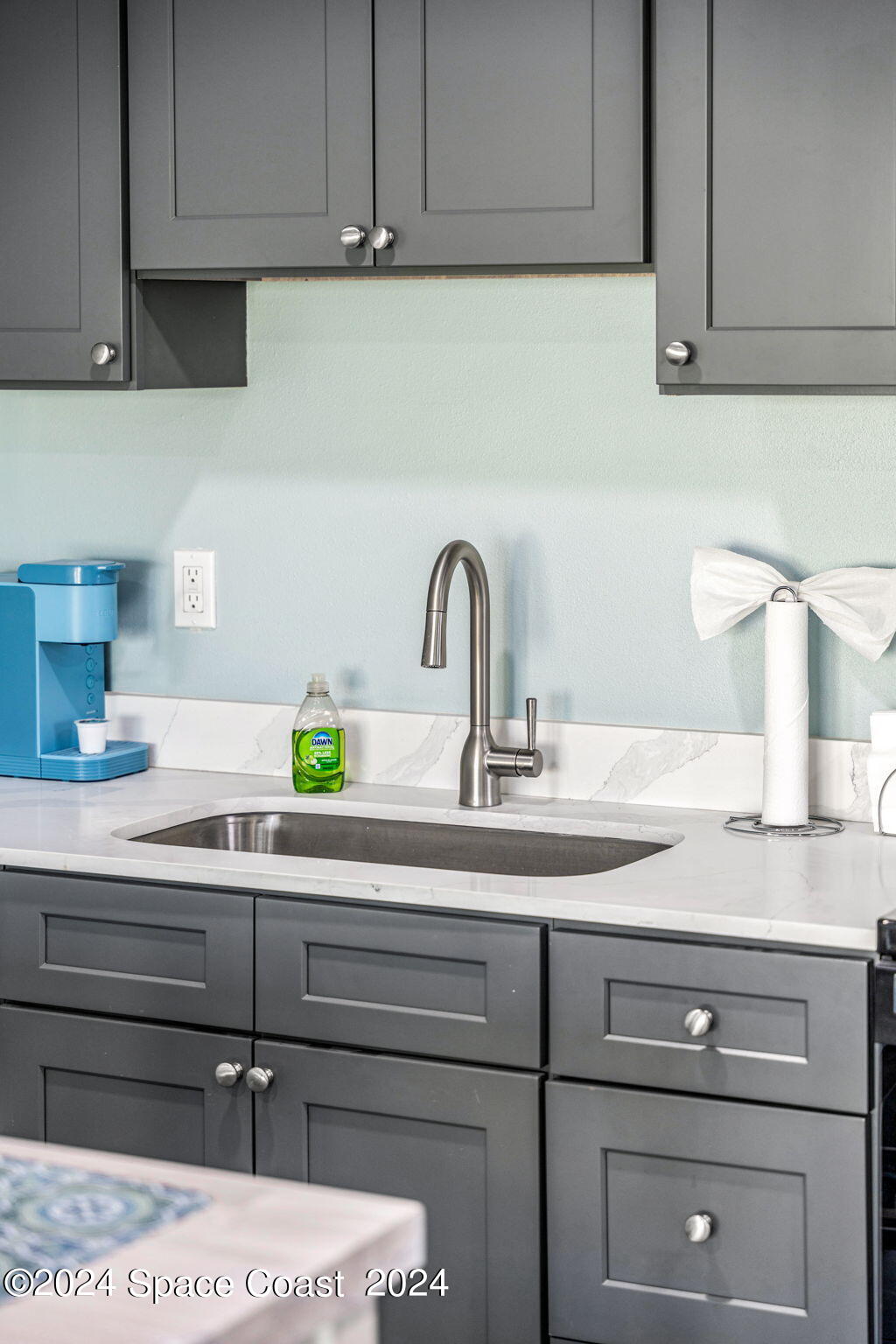 2189 Pineapple Avenue, Unit C Melbourne, FL 32935 - Photo 53 of 67 a close view of sink and cabinets
