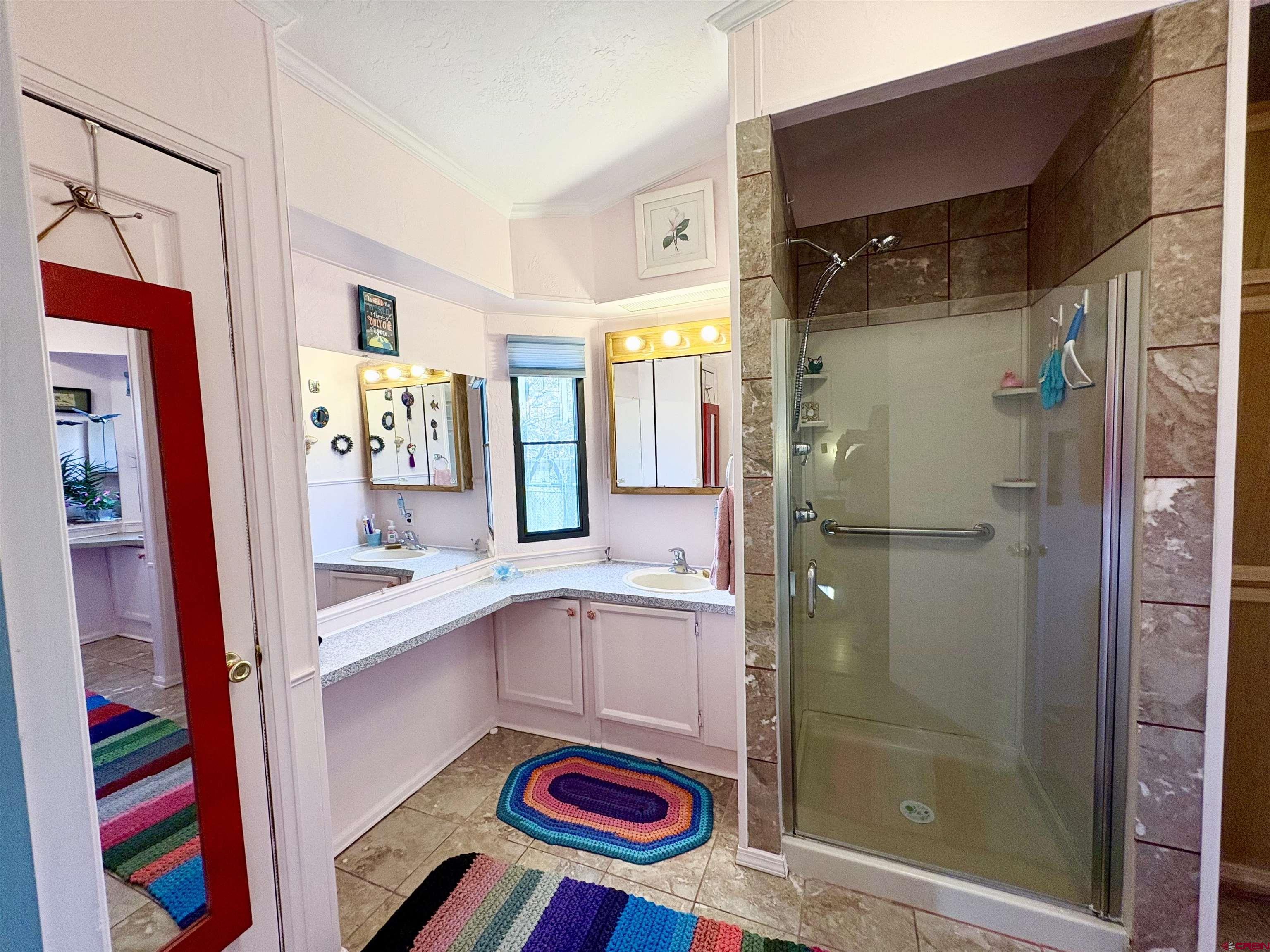 3 Lomas Drive Durango, CO 81301 - Photo 13 of 26 a bathroom with a sink and a shower