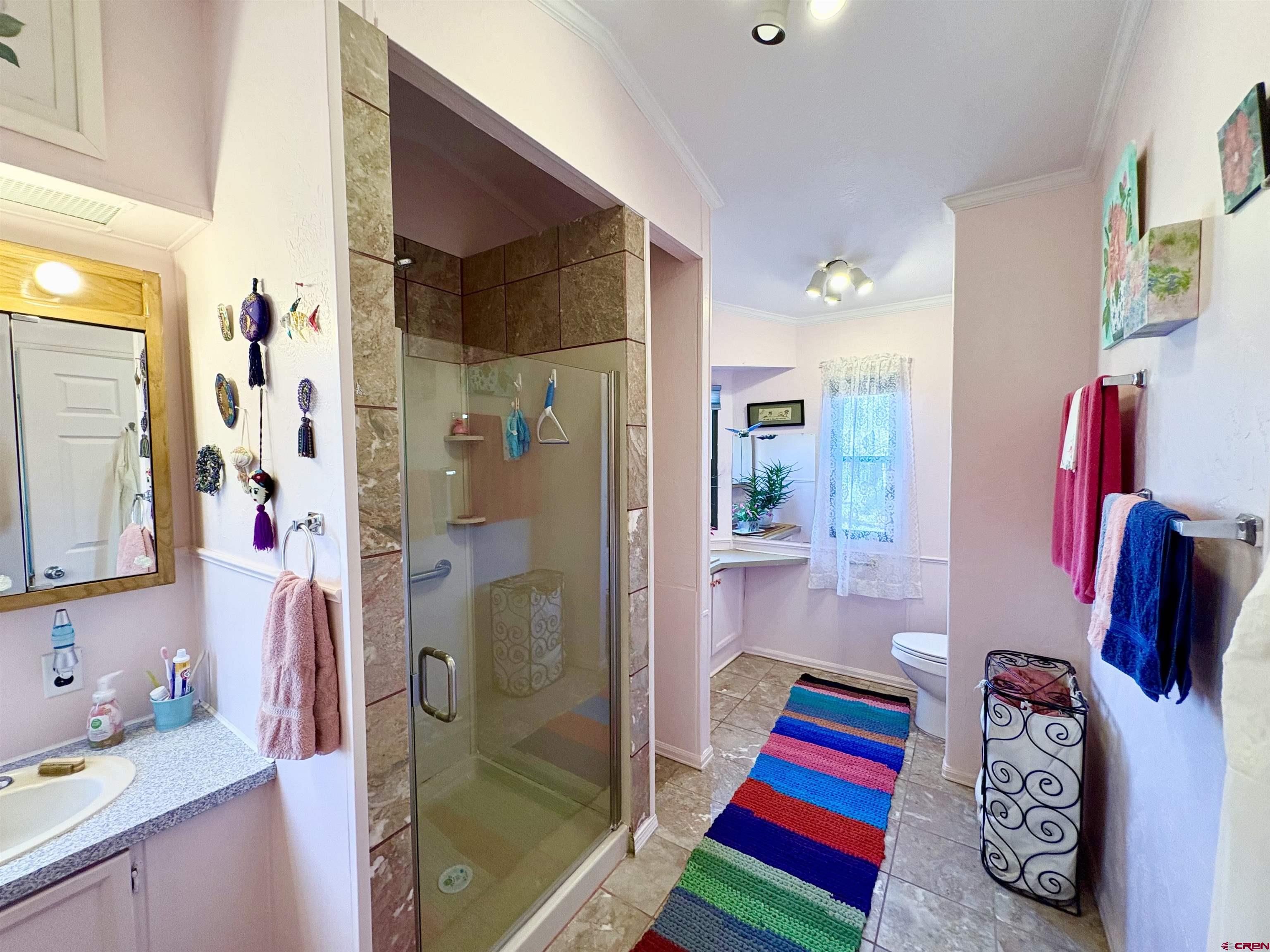 3 Lomas Drive Durango, CO 81301 - Photo 15 of 26 a bathroom with a bathtub and a shower