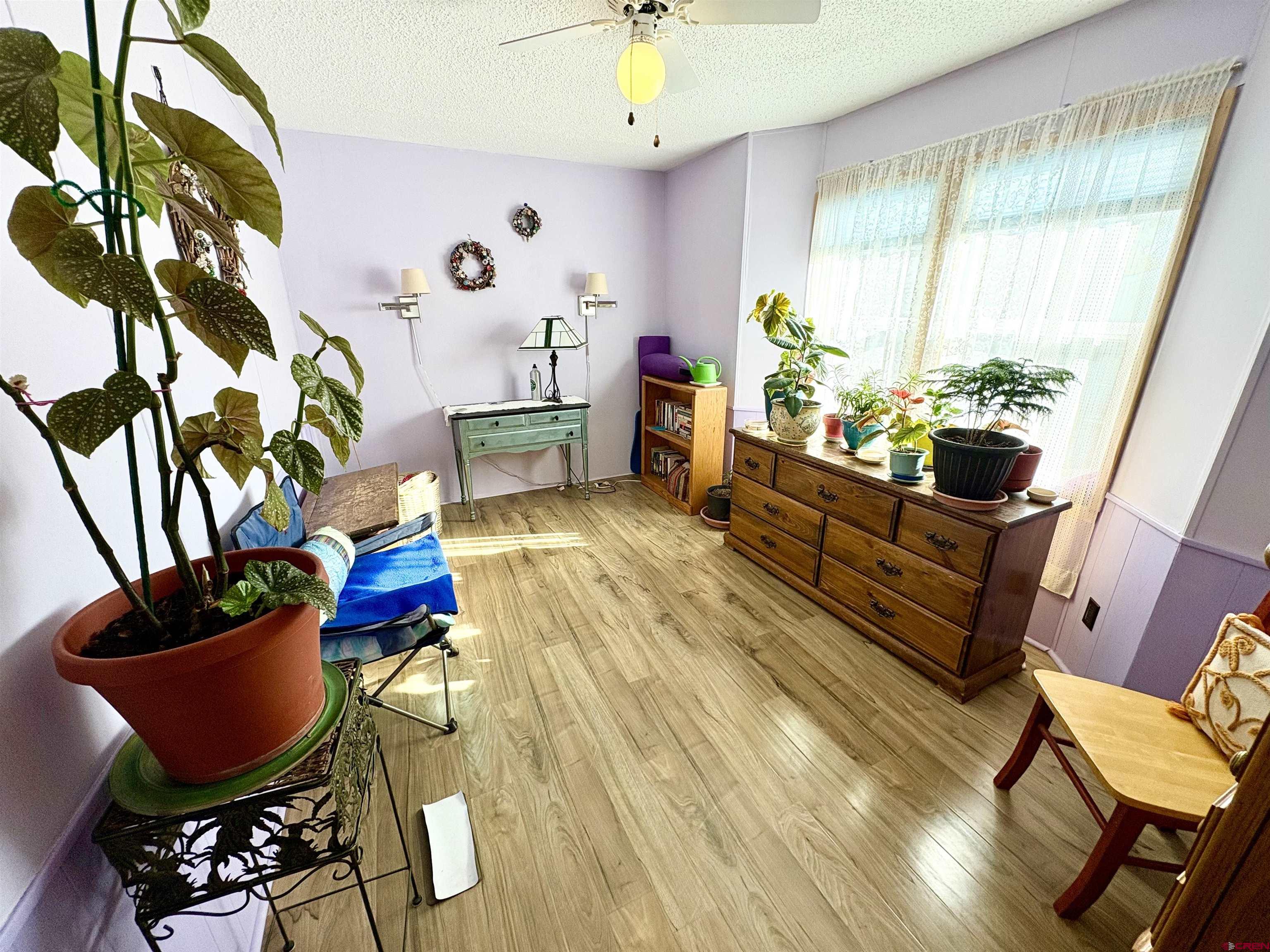 3 Lomas Drive Durango, CO 81301 - Photo 17 of 26 a living room with furniture dining table a rug and a potted plant