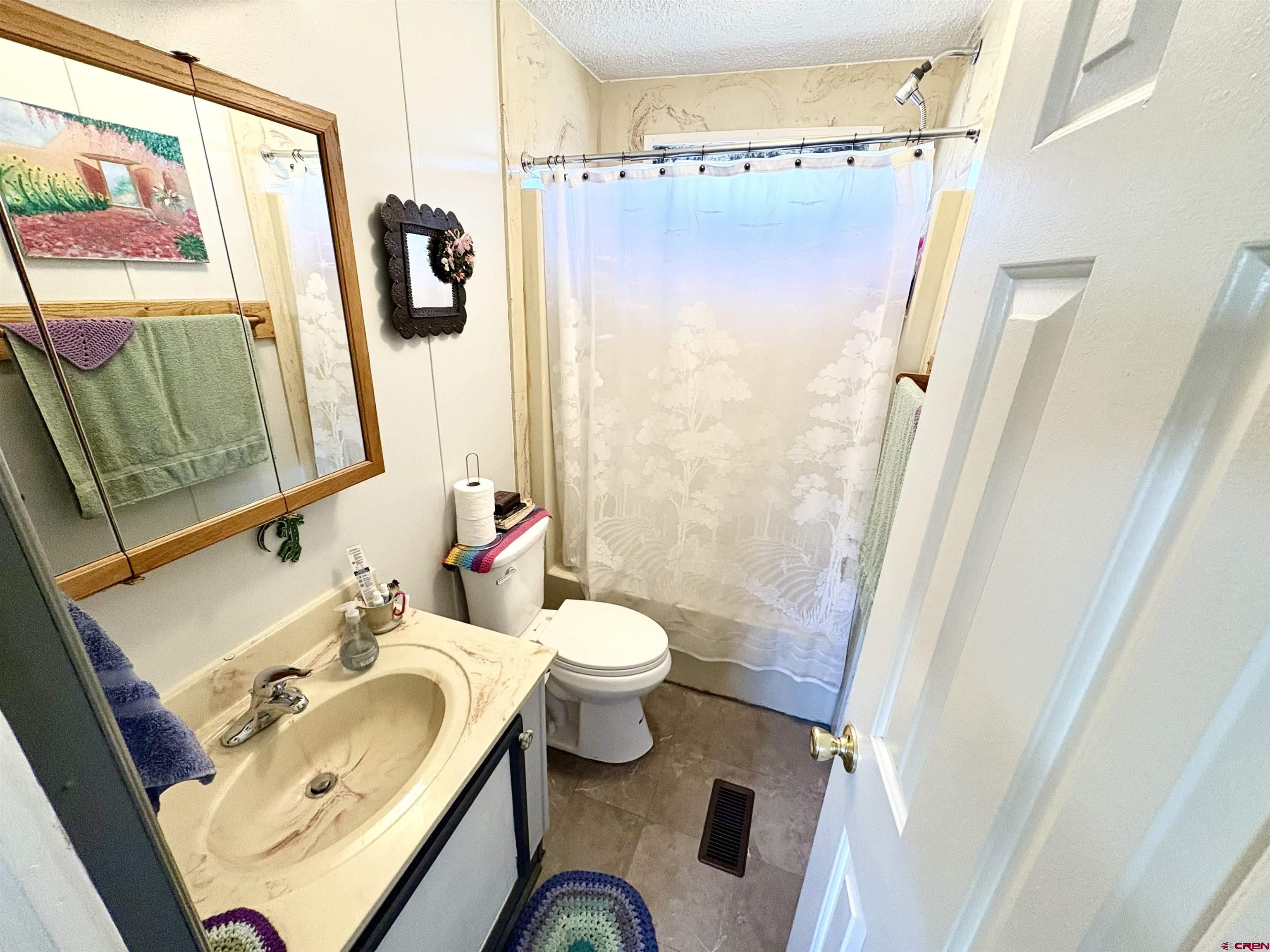 3 Lomas Drive Durango, CO 81301 - Photo 19 of 26 a bathroom with a sink toilet and shower