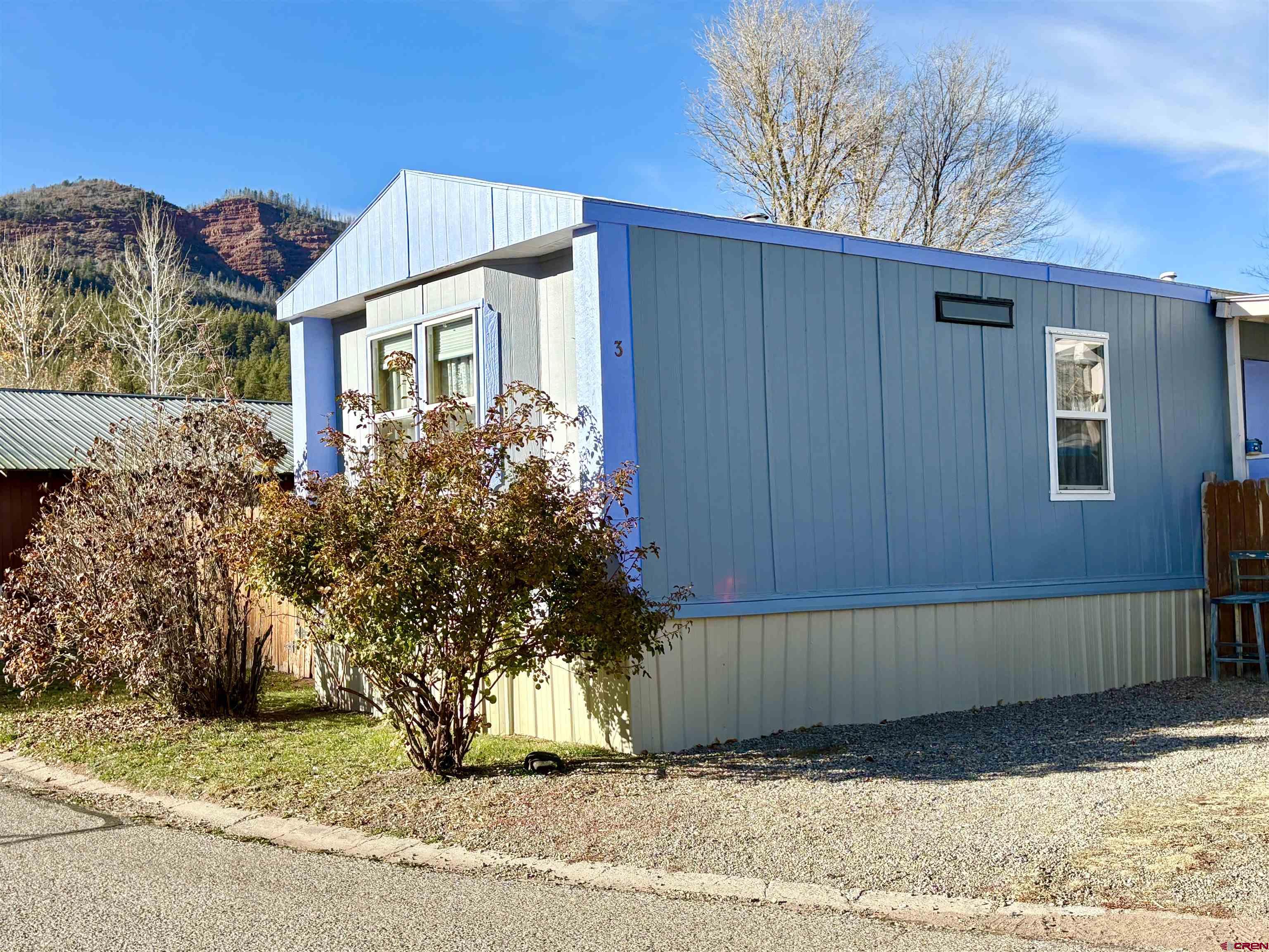 3 Lomas Drive Durango, CO 81301 - Photo 2 of 26 a front view of a house with a yard
