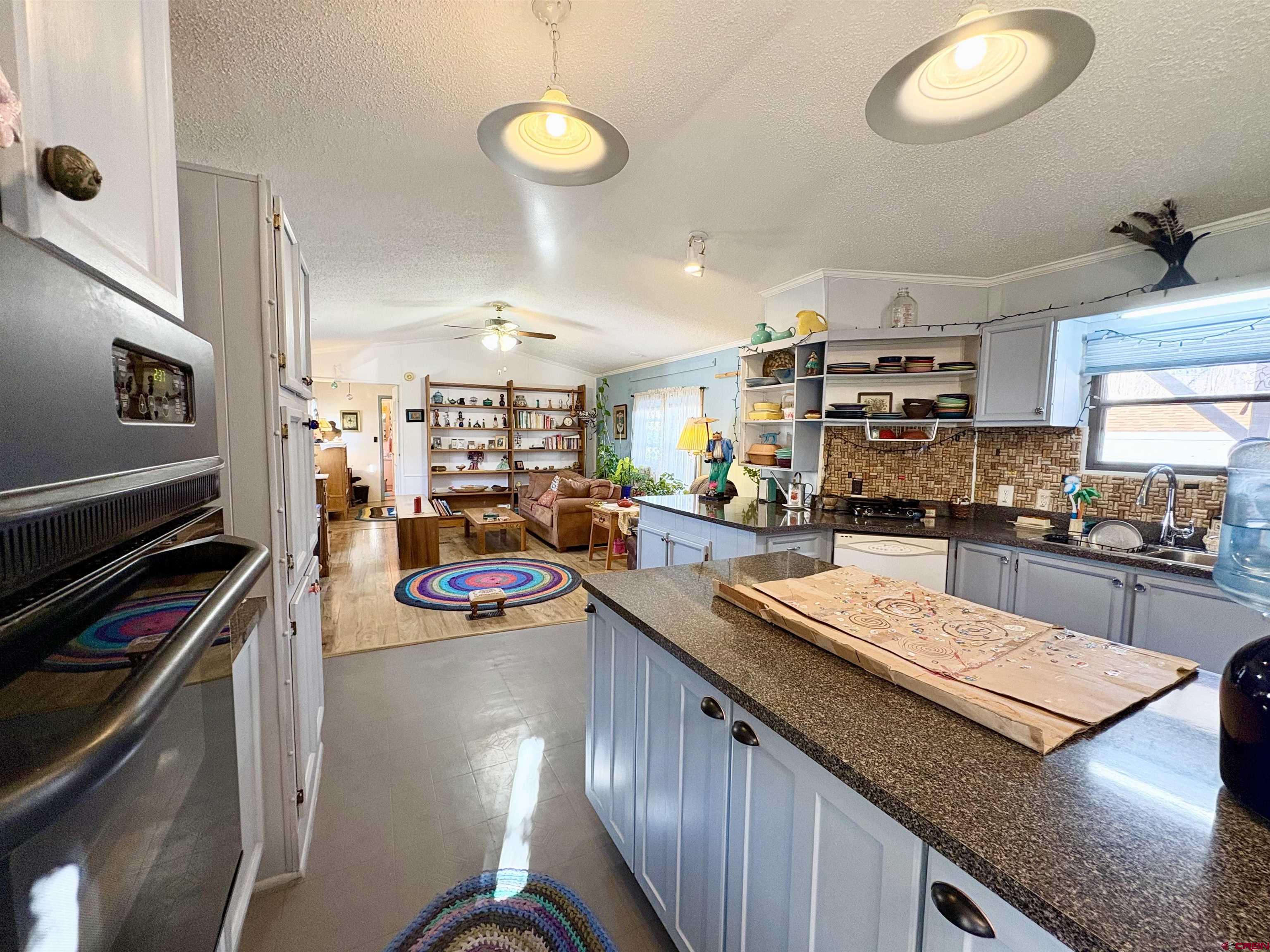 3 Lomas Drive Durango, CO 81301 - Photo 4 of 26 a kitchen with stainless steel appliances lots of counter top space