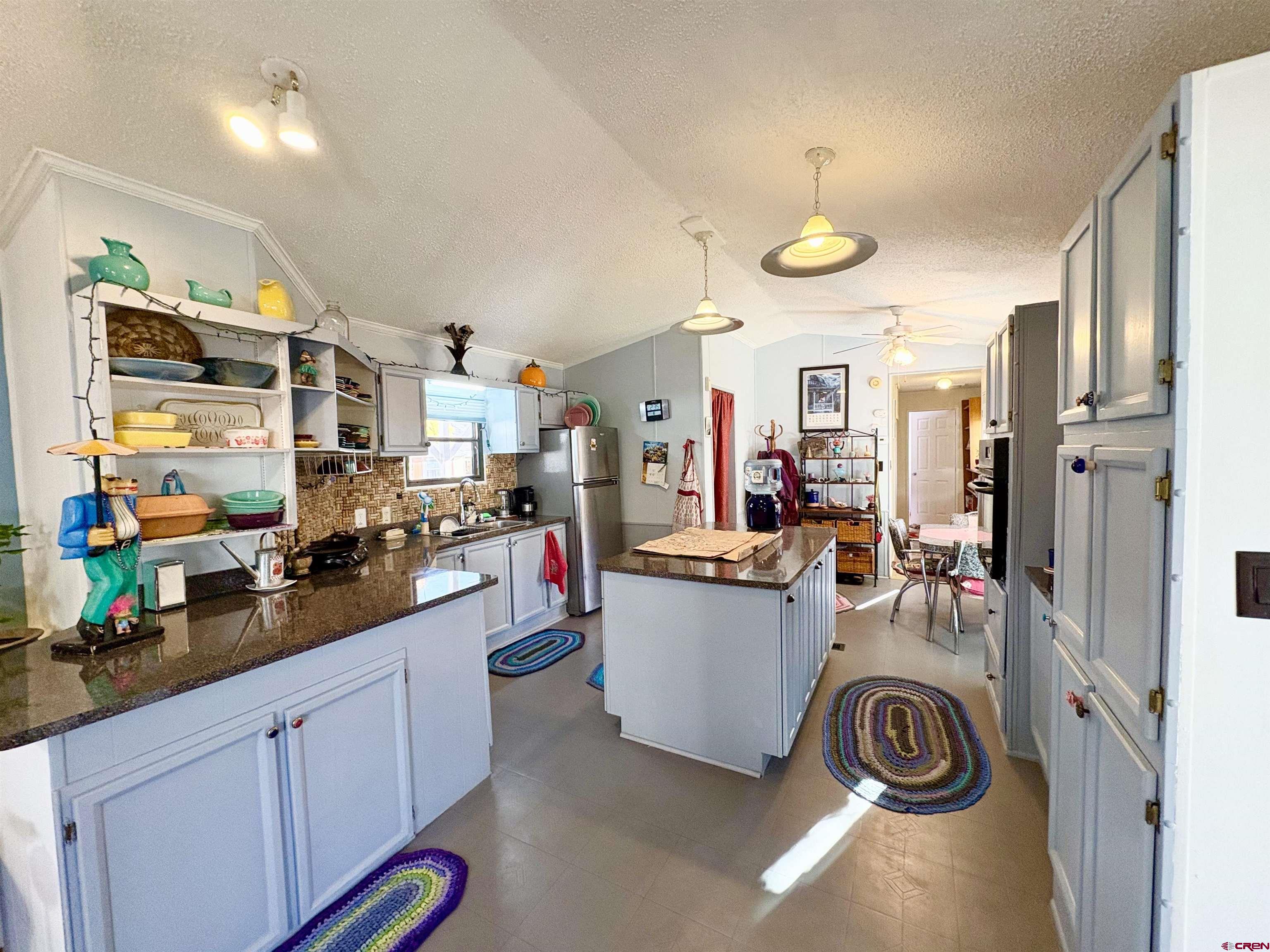 3 Lomas Drive Durango, CO 81301 - Photo 7 of 26 a kitchen view of counter top space and wooden floor