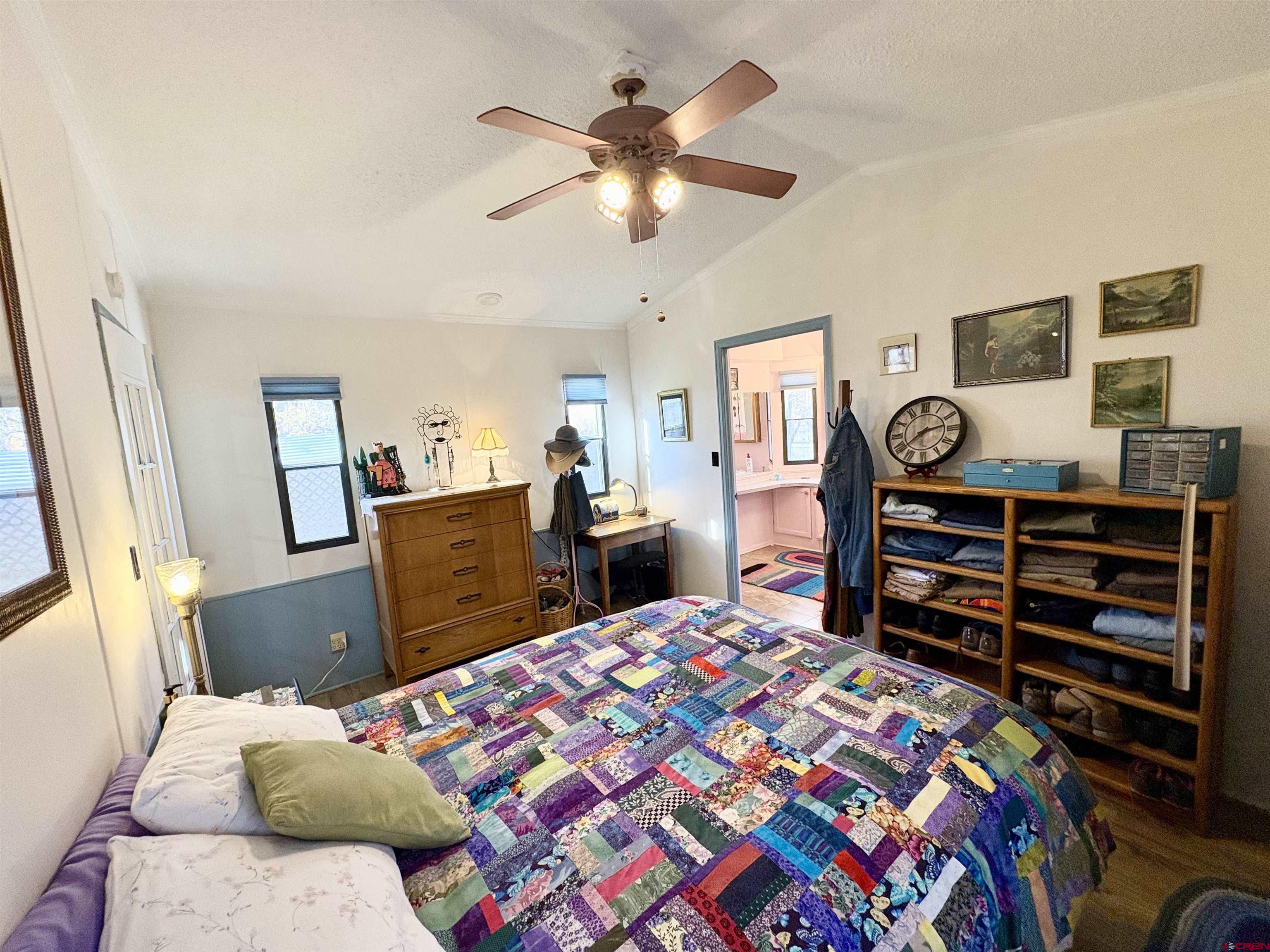 3 Lomas Drive Durango, CO 81301 - Photo 10 of 26 a bedroom with a bed and wooden floor