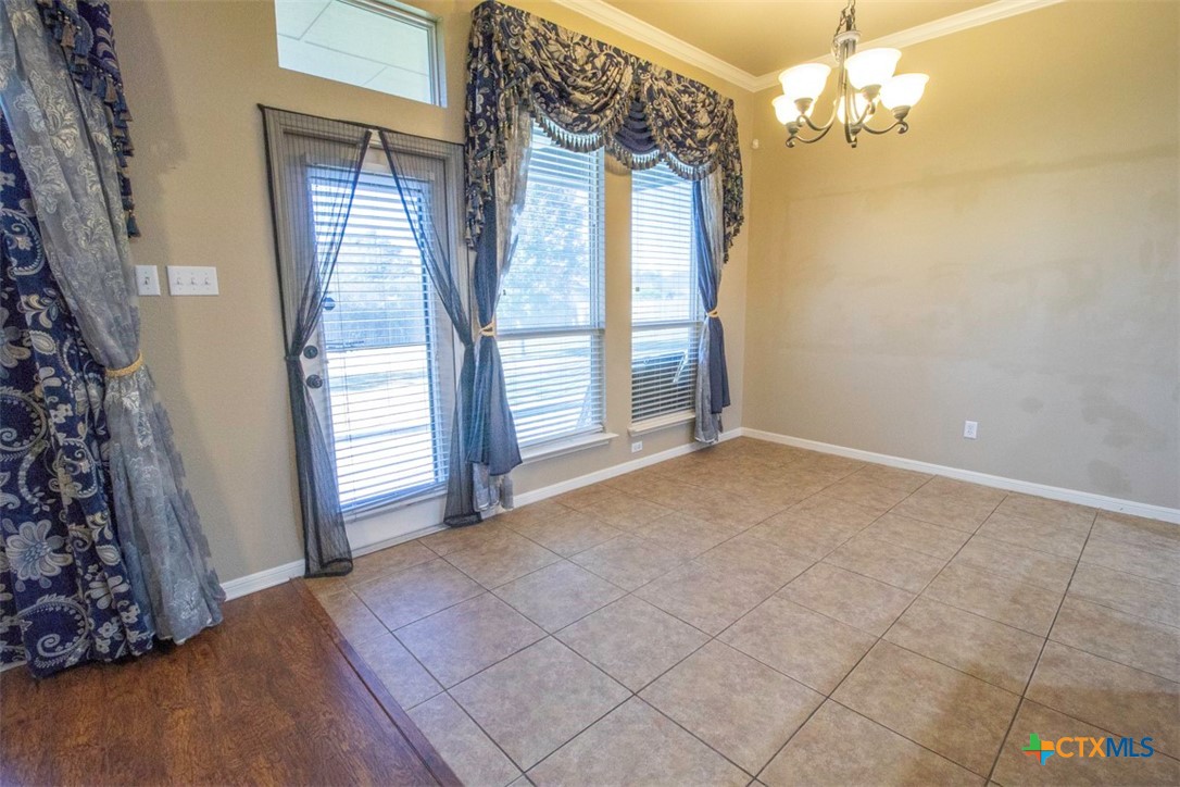 7022 Valley Mist Drive Temple, TX 76502 - Photo 15 of 36 wooden floor in an empty room with a window