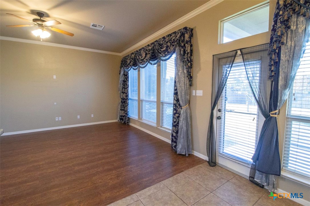 7022 Valley Mist Drive Temple, TX 76502 - Photo 17 of 36 a view of an empty room with a window and wooden floor