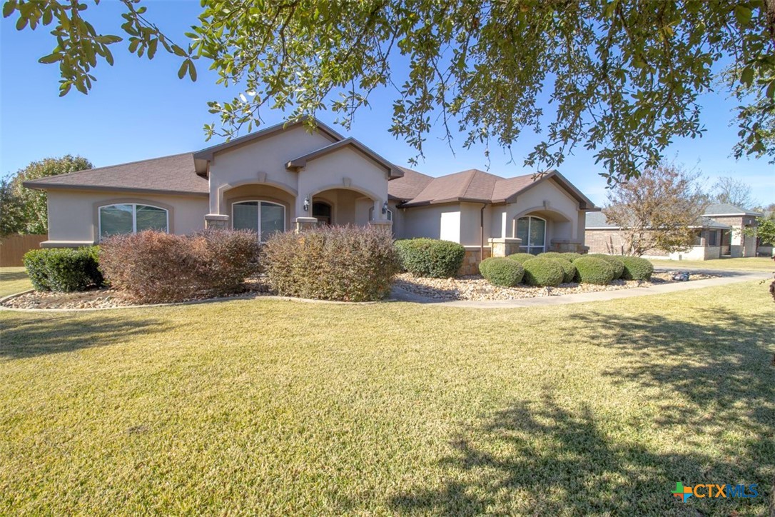 7022 Valley Mist Drive Temple, TX 76502 - Photo 5 of 36 a front view of a house with a yard and trees