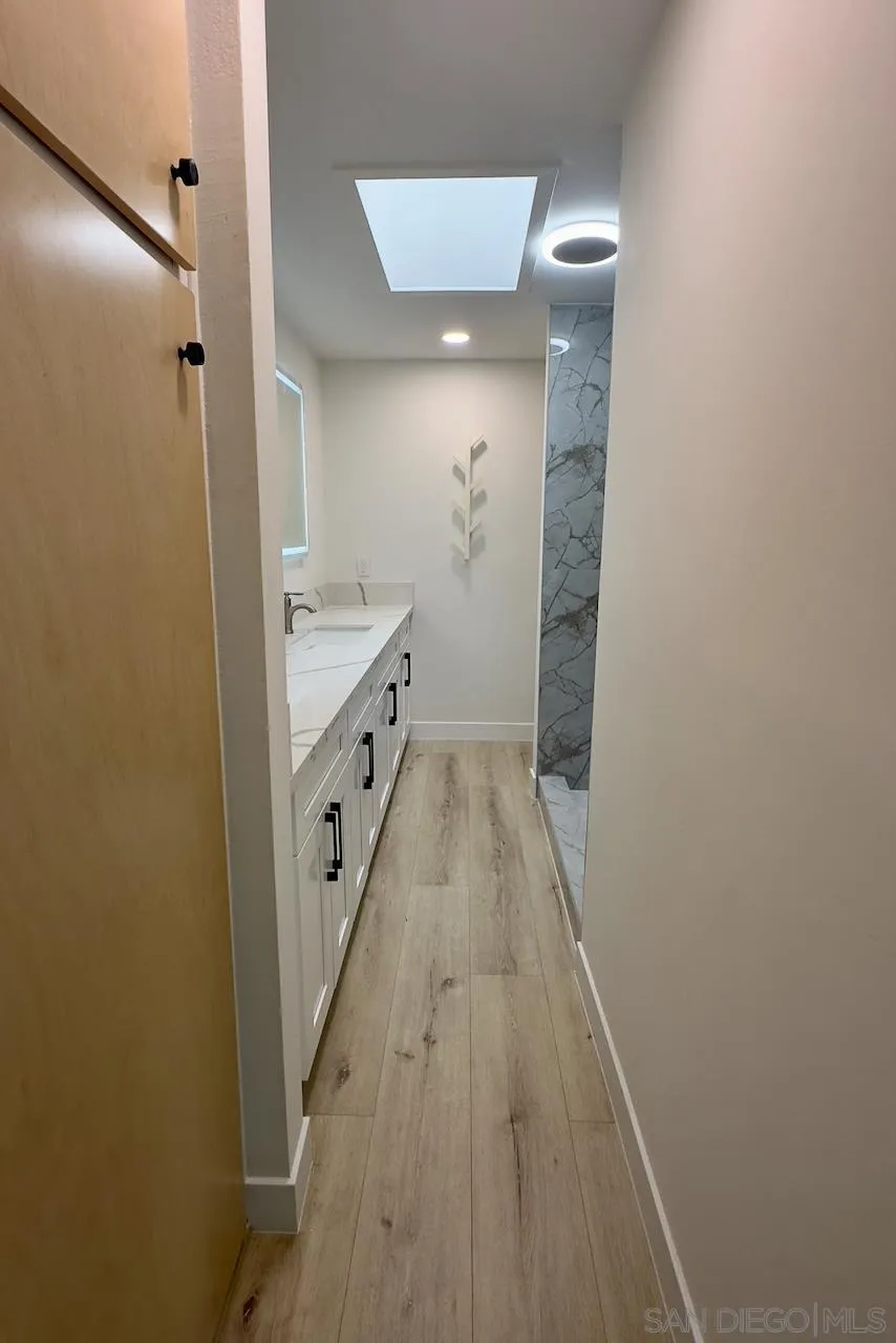 4529 Kittiwake Way Oceanside, CA 92057 - Photo 14 of 23 a bathroom with a sink and a mirror