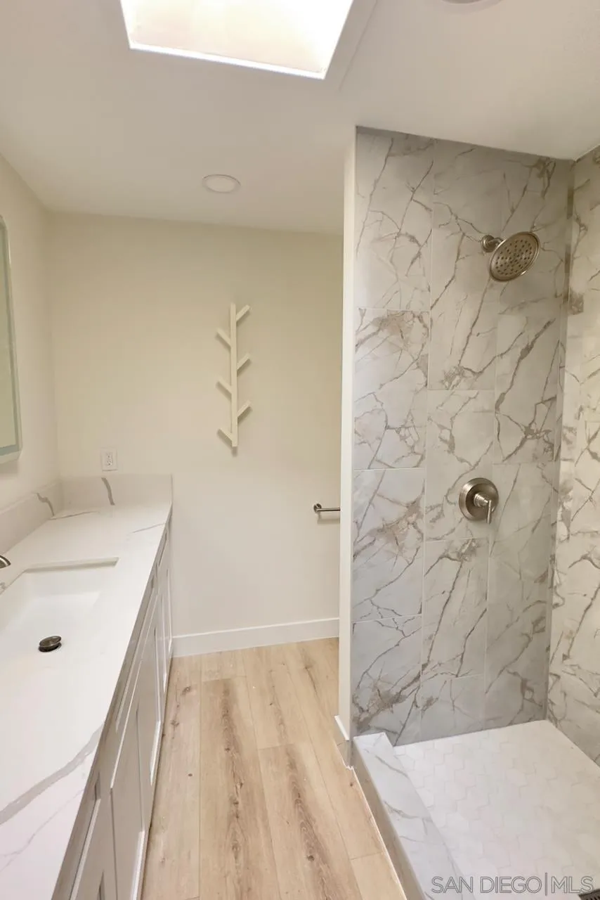 4529 Kittiwake Way Oceanside, CA 92057 - Photo 15 of 23 a bathroom with a sink and a shower