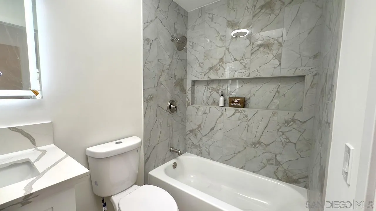 4529 Kittiwake Way Oceanside, CA 92057 - Photo 17 of 23 a bathroom with a toilet and a bathtub
