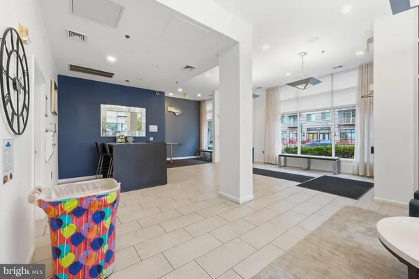 a view of kitchen with furniture and flat screen tv