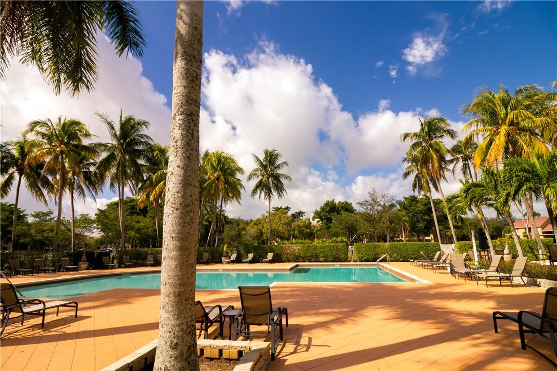 801 Lyons Road, Unit 19203 Coconut Creek, FL 33063 - Photo 3 of 3 a view of a yard with palm tree