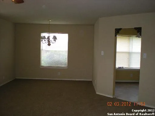 a view of an empty room and window