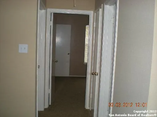 a view of a bathroom from a hallway