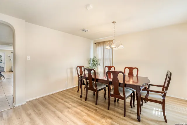 a dining room with furniture and window