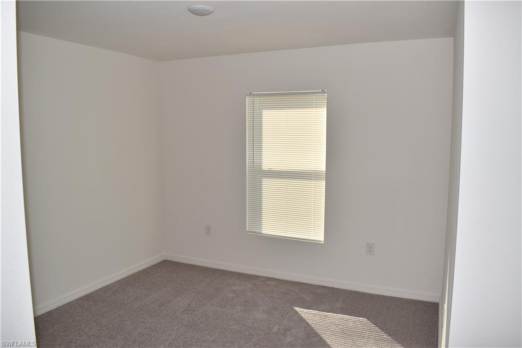 8388 Delong Avenue North Port, FL 34291 - Photo 17 of 21 an empty room with a window