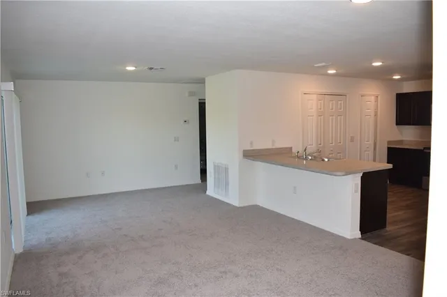 a bathroom with a sink a toilet and a shower
