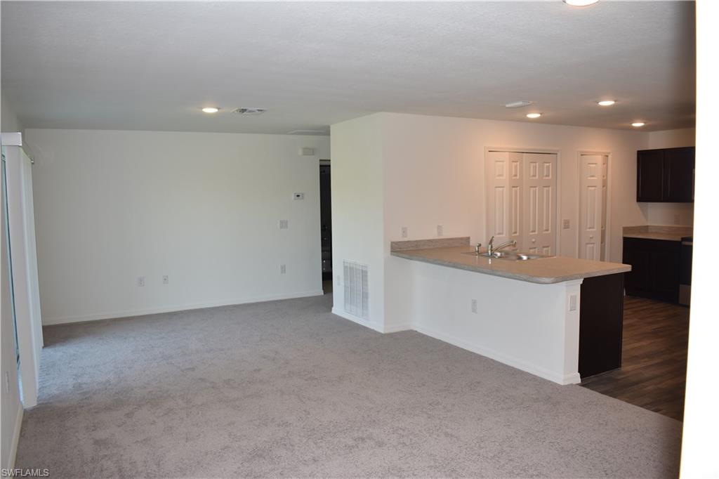 8388 Delong Avenue North Port, FL 34291 - Photo 6 of 21 a bathroom with a sink a toilet and a shower