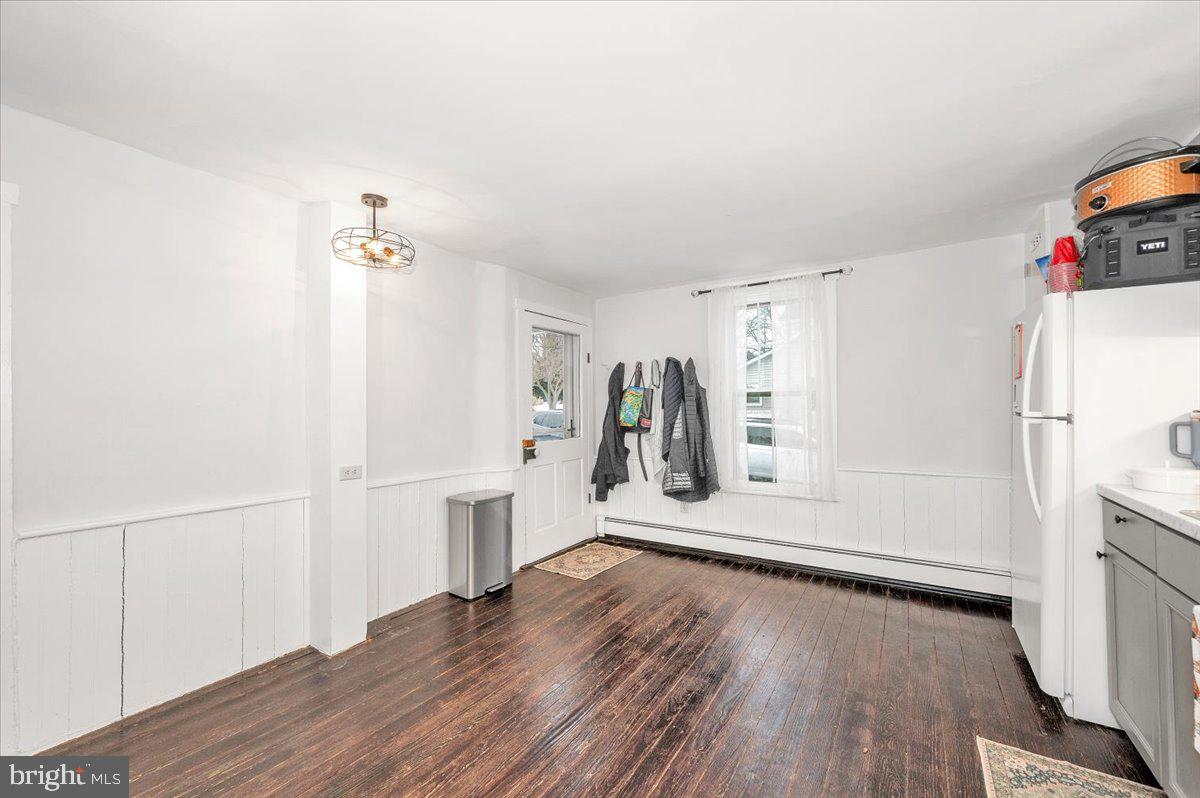 30 Tillie Town Road Biglerville, PA 17307 - Photo 13 of 44 a view of a room with wooden floor and a refrigerator
