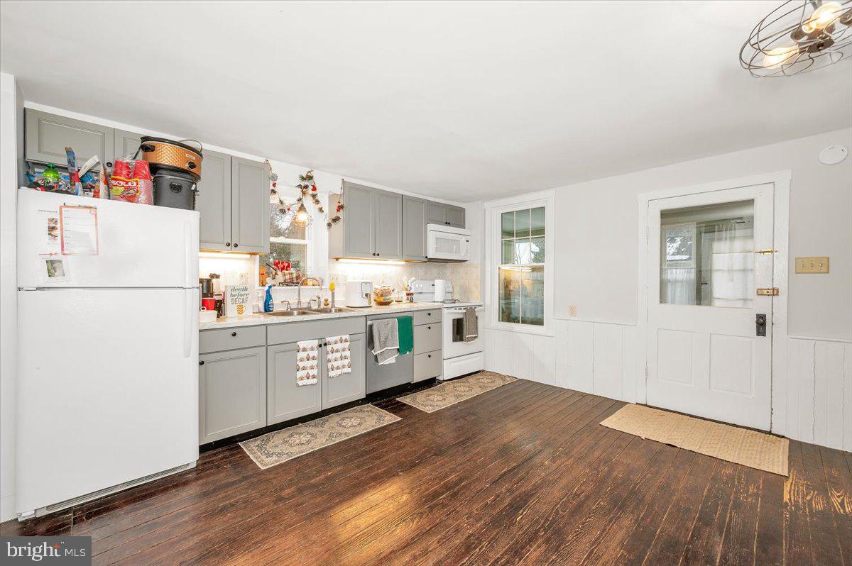 30 Tillie Town Road Biglerville, PA 17307 - Photo 10 of 44 a kitchen with a refrigerator and white cabinets
