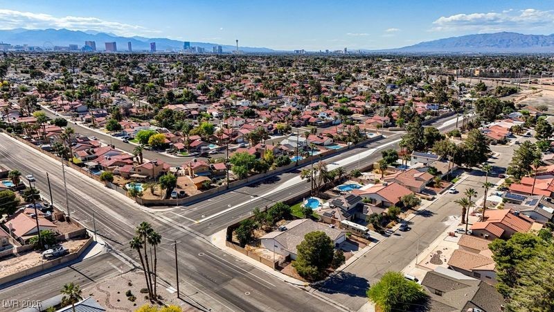 5274 Somerset Drive Las Vegas, NV 89120 - Photo 29 of 31 Aerial view of residential area featuring a mountainous background