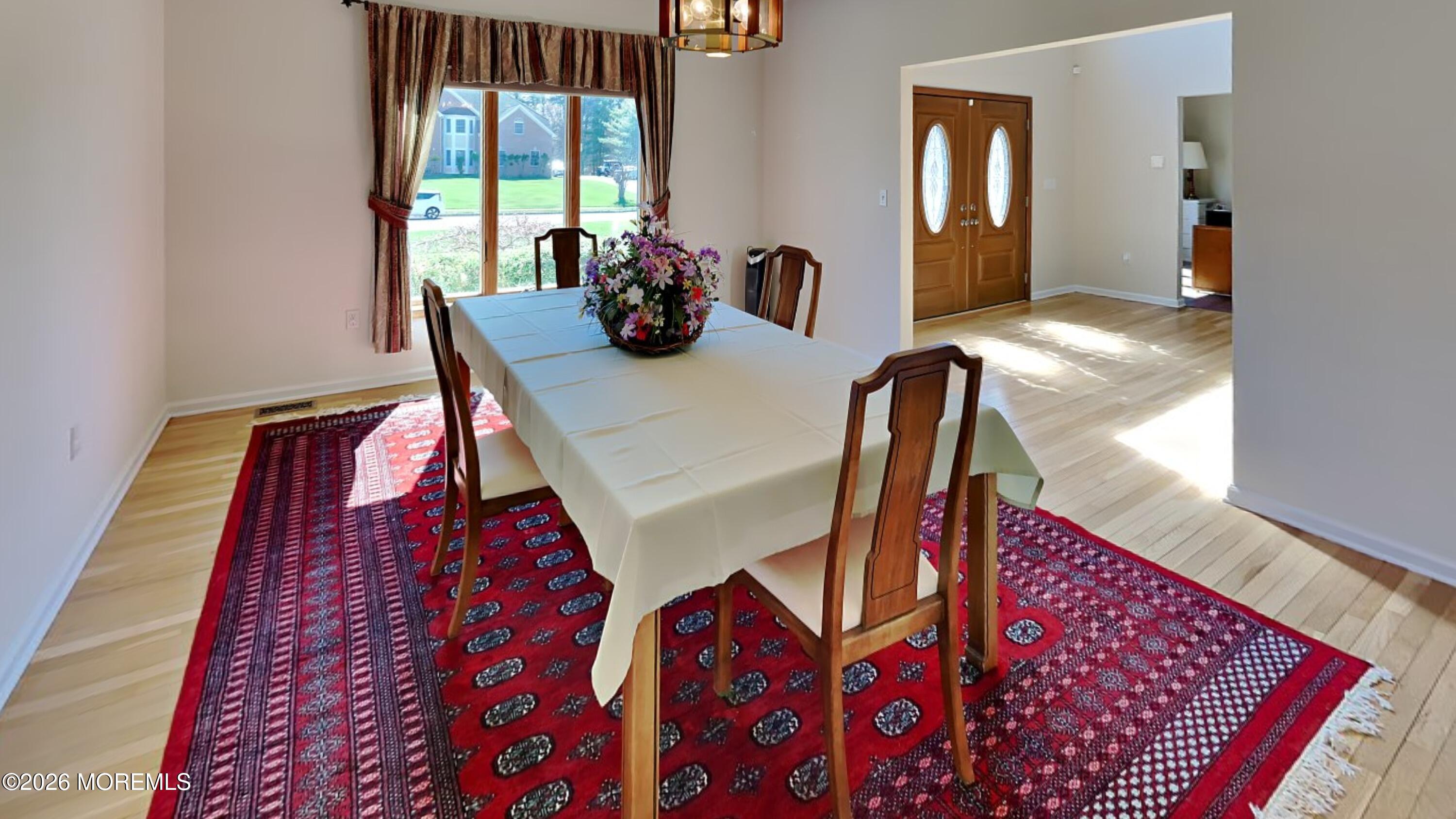 33 Mill Pond Road Jackson, NJ 08527 - Photo 13 of 49 a view of a dining room with furniture and a potted plant