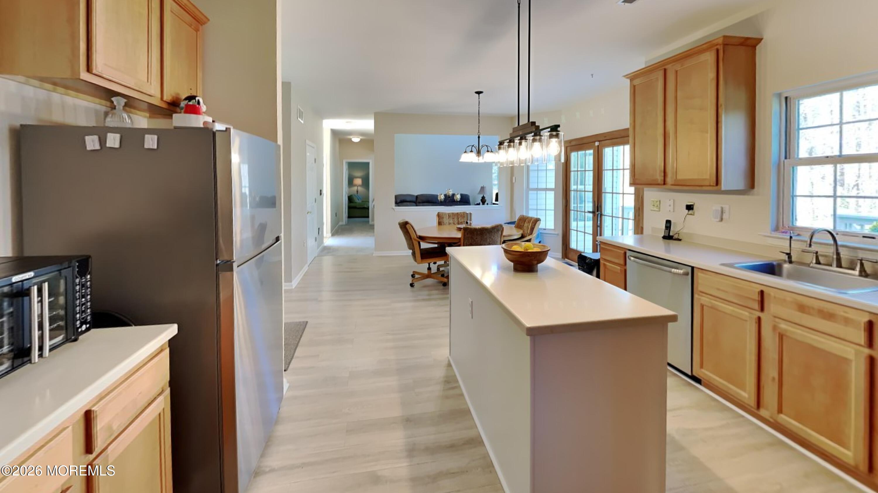 33 Mill Pond Road Jackson, NJ 08527 - Photo 20 of 49 a large kitchen with a large counter top space a sink stainless steel appliances and cabinets