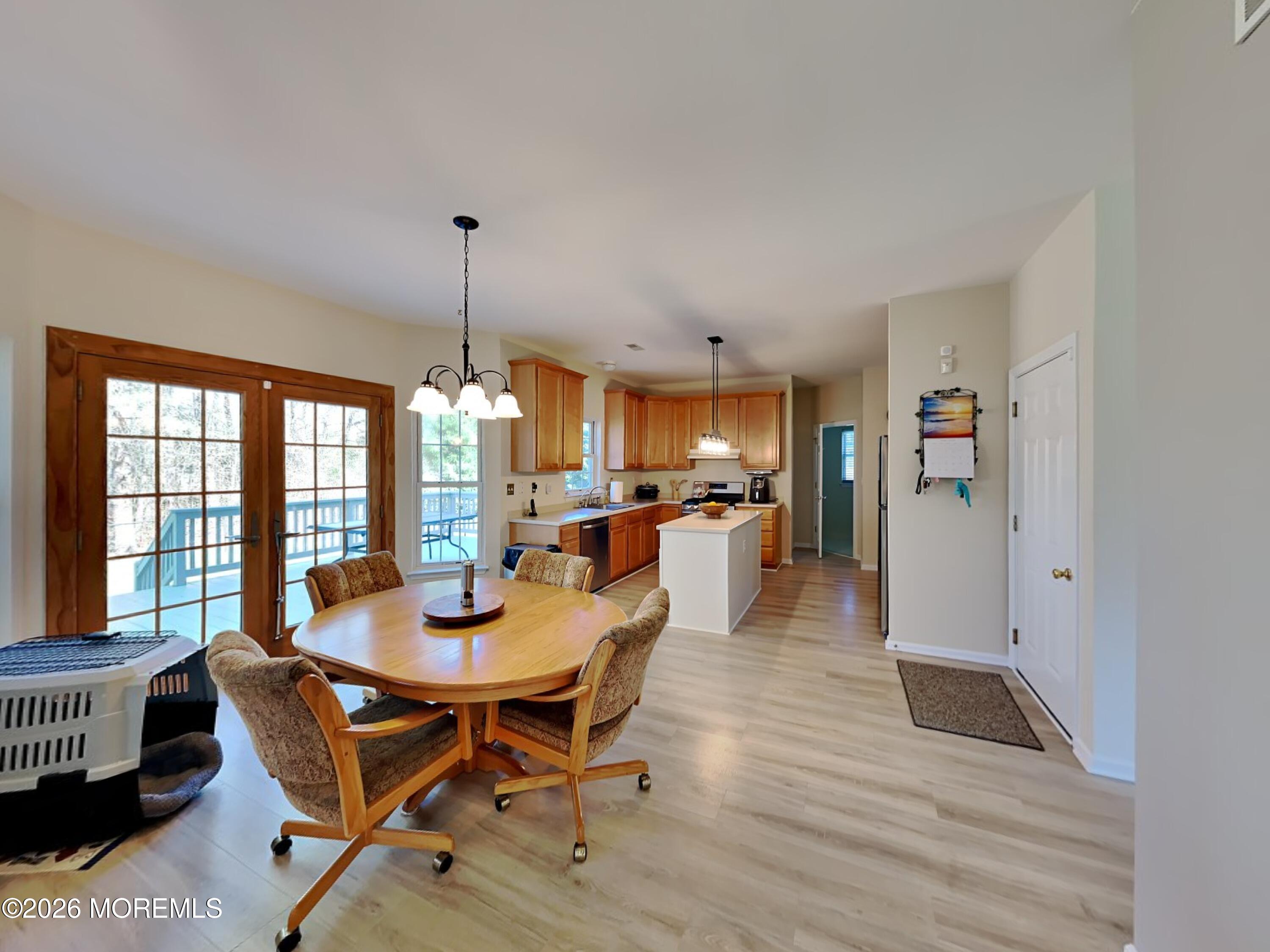 33 Mill Pond Road Jackson, NJ 08527 - Photo 21 of 49 a dining room with furniture window wooden floor