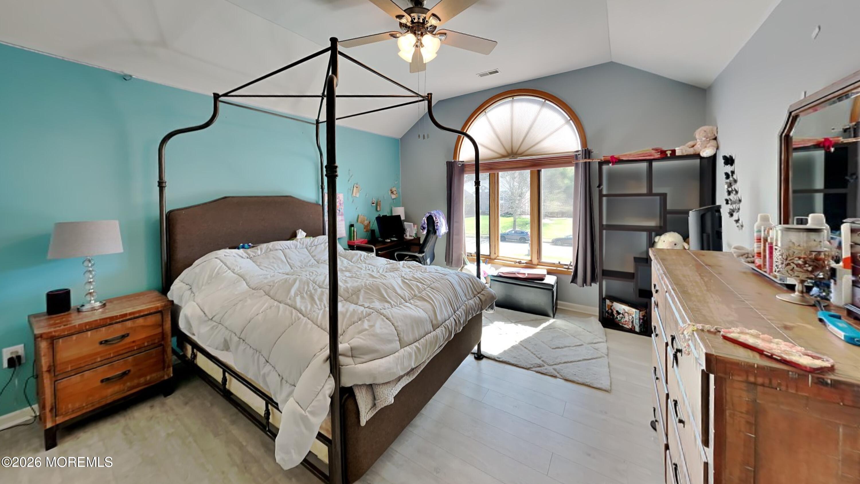 33 Mill Pond Road Jackson, NJ 08527 - Photo 37 of 49 a bedroom with a bed window and a chandelier