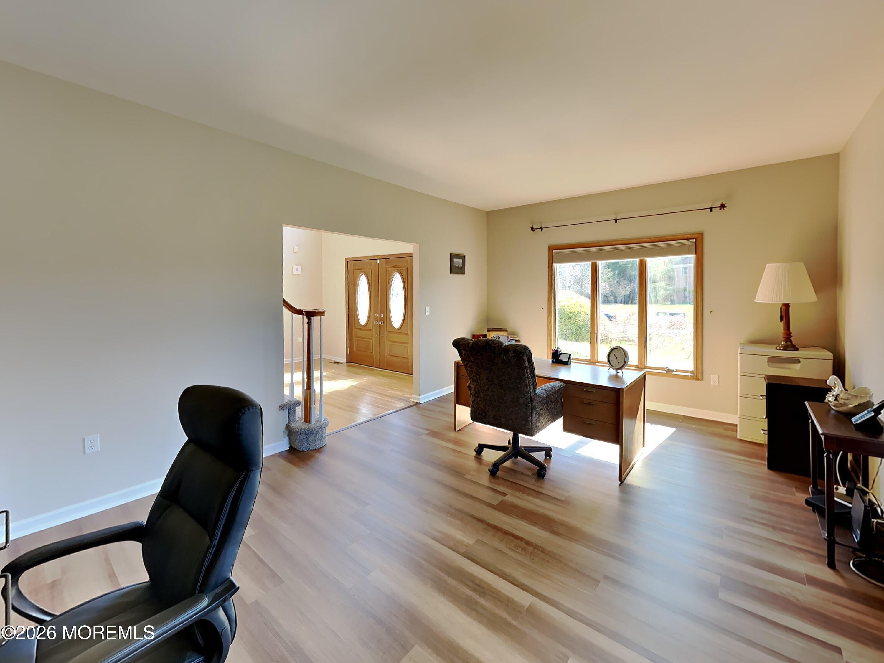 33 Mill Pond Road Jackson, NJ 08527 - Photo 7 of 49 a view of a workspace with furniture and a window