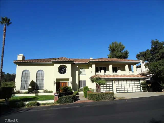 front view of a house with a street