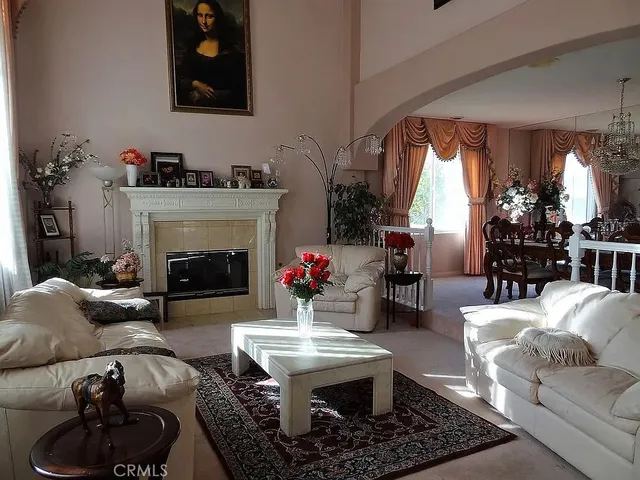 a living room with furniture and a fireplace