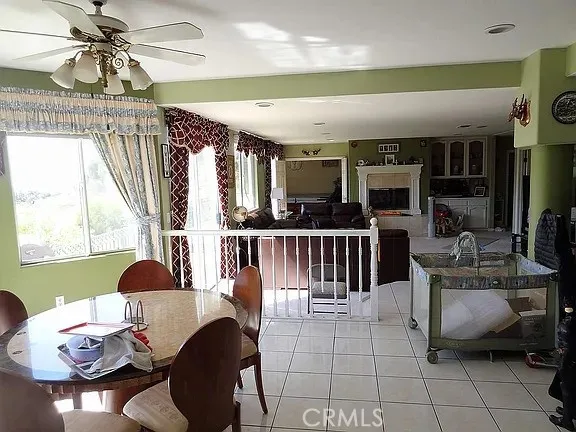 a dining room with furniture and a chandelier