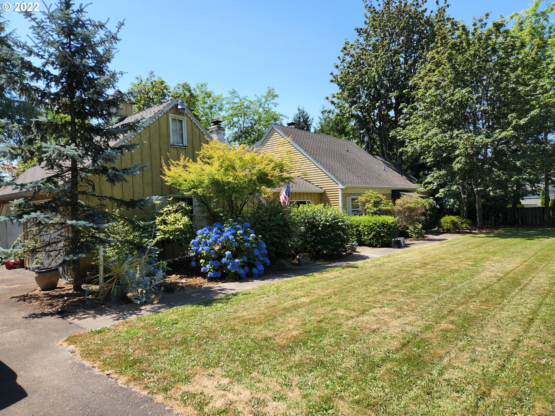 7400 Boeckman Road Wilsonville, OR 97070 - Photo 2 of 3 a view of a house with a yard and potted plants