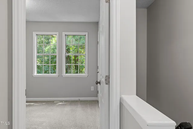 a view of a hallway with a closet