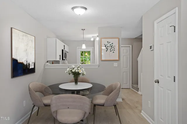 a dining room with furniture and window