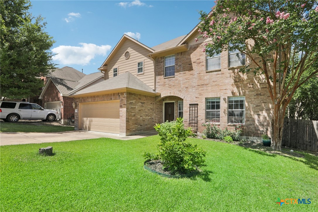 403 Red Hawk Drive Leander, TX 78641 - Photo 14 of 35 a front view of a house with a yard and garage