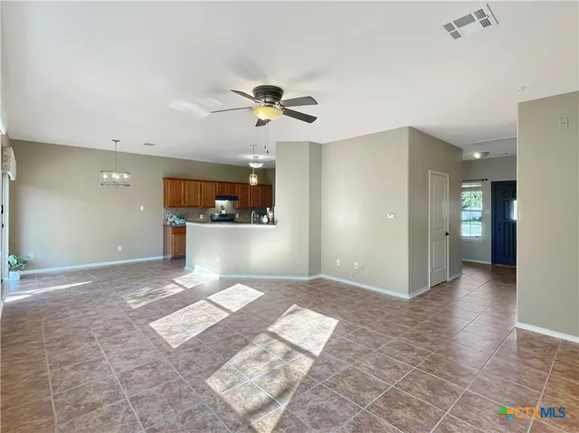 a view of a kitchen with a sink and a window