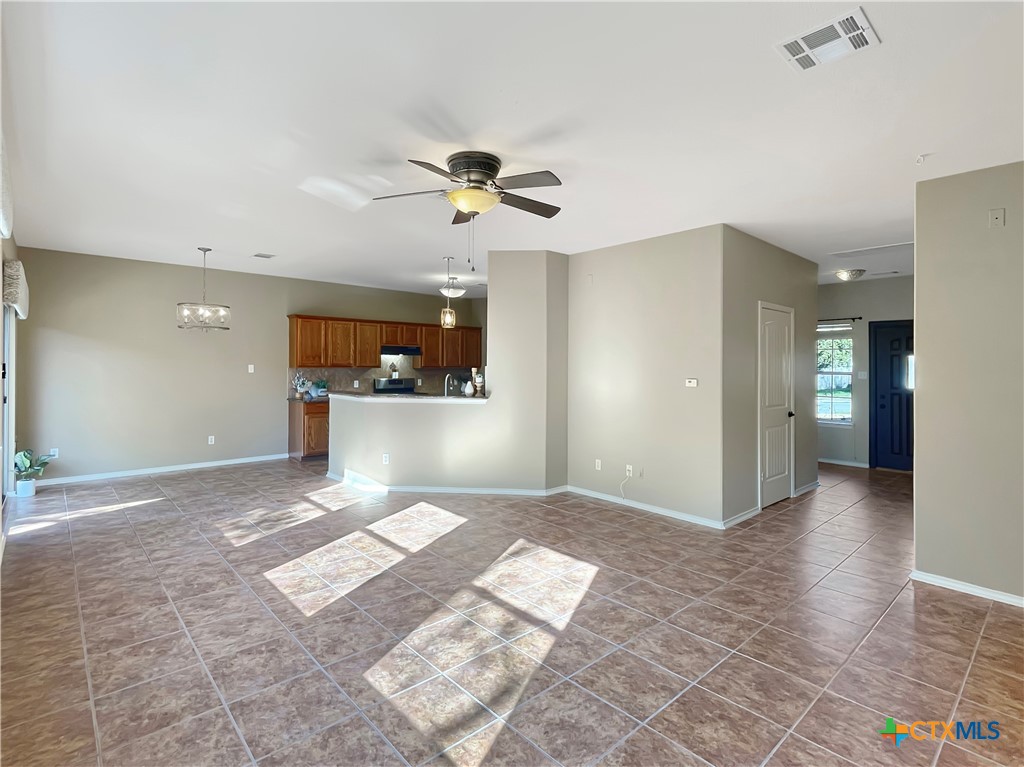 403 Red Hawk Drive Leander, TX 78641 - Photo 19 of 35 a view of a kitchen with a sink and a window